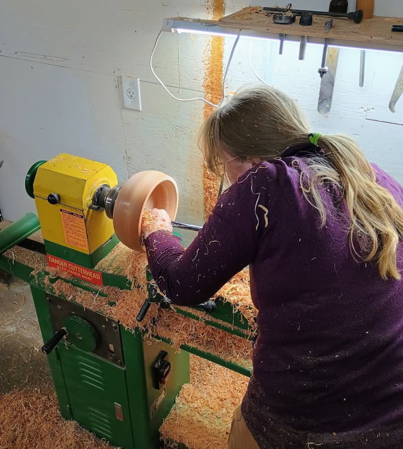A member turning a wooden bowl on our lathe