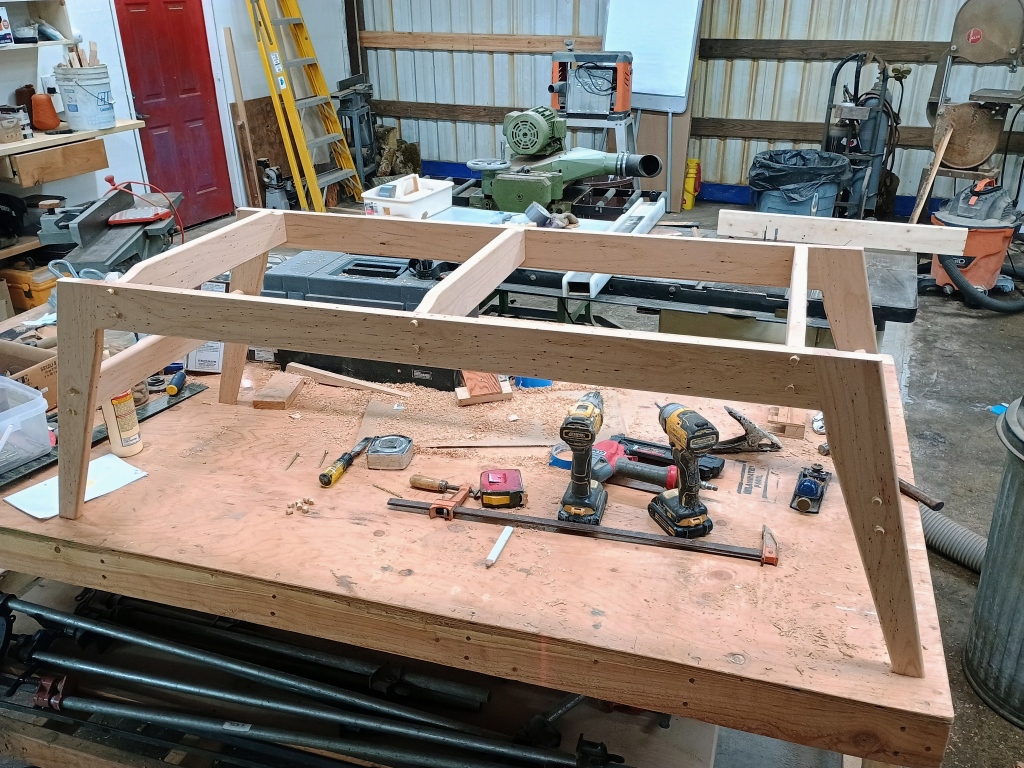 The legs of a coffee table, table top missing.