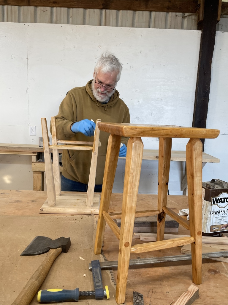 Surface finish being applied to the stools