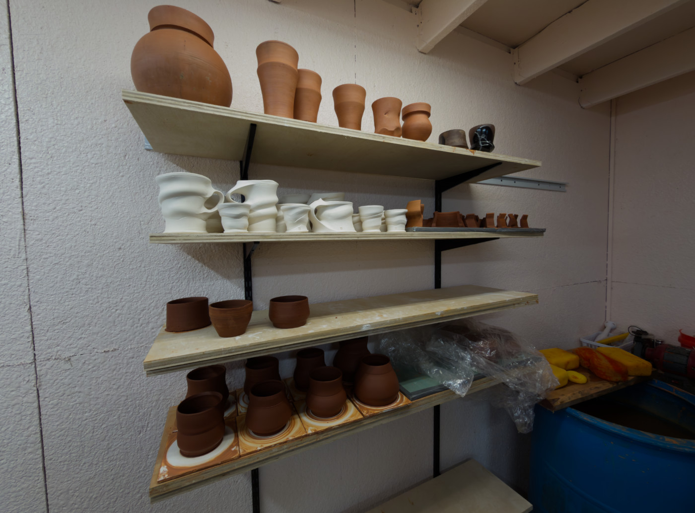 Pottery projects on a shelf